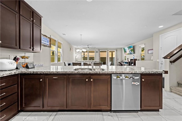 kitchen with dark brown cabinetry, a healthy amount of sunlight, dishwasher, and a sink