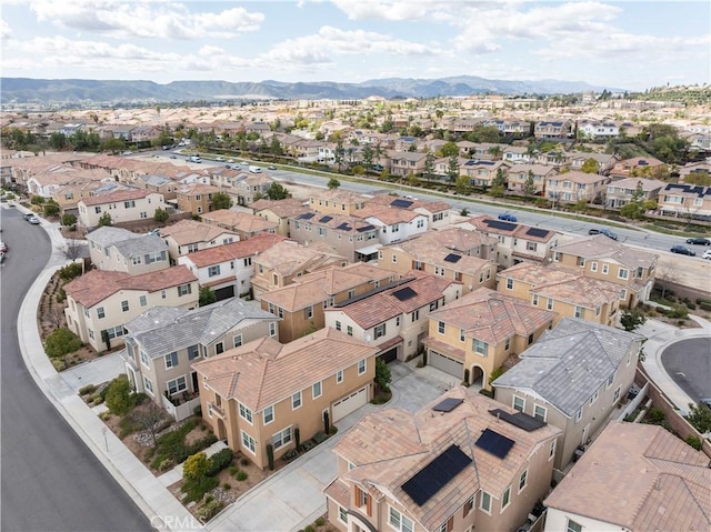 birds eye view of property featuring a mountain view and a residential view