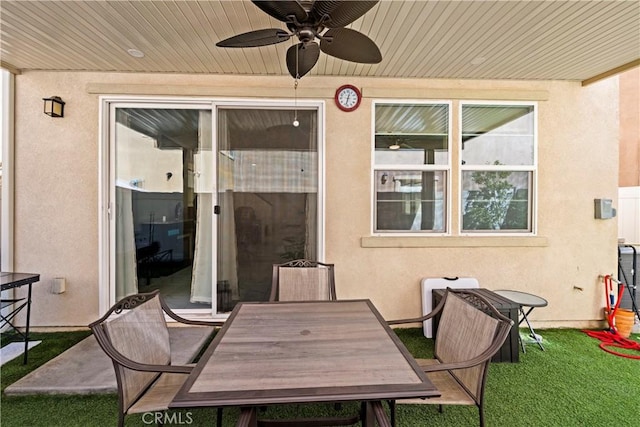 view of patio featuring outdoor dining area and ceiling fan