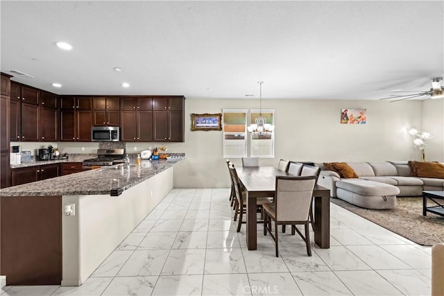 kitchen with visible vents, marble finish floor, recessed lighting, dark stone counters, and appliances with stainless steel finishes