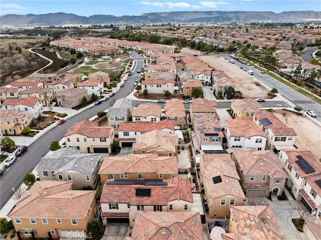 drone / aerial view featuring a mountain view and a residential view