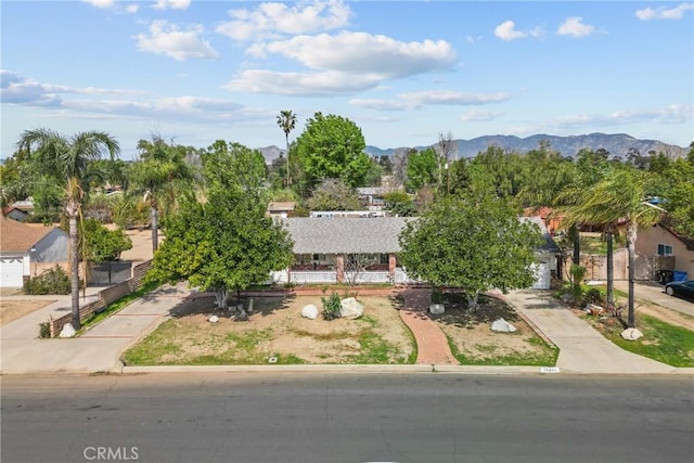 birds eye view of property with a mountain view