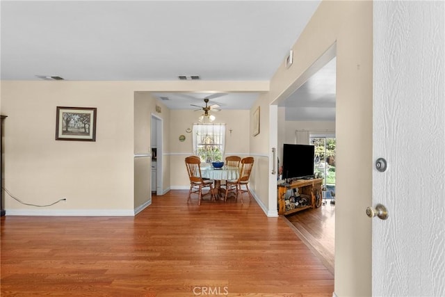 interior space featuring visible vents, baseboards, and light wood-style floors