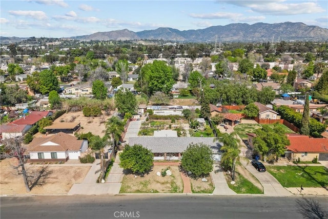 drone / aerial view featuring a residential view and a mountain view