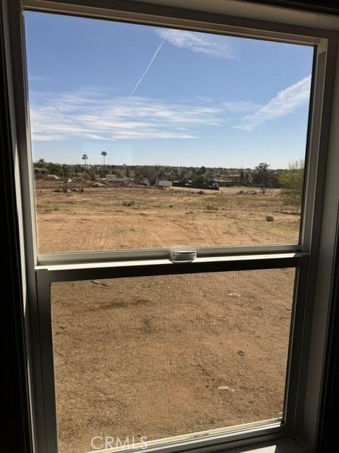 view of yard with a balcony