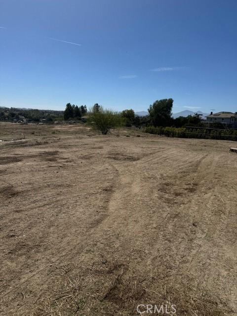 view of yard with a rural view