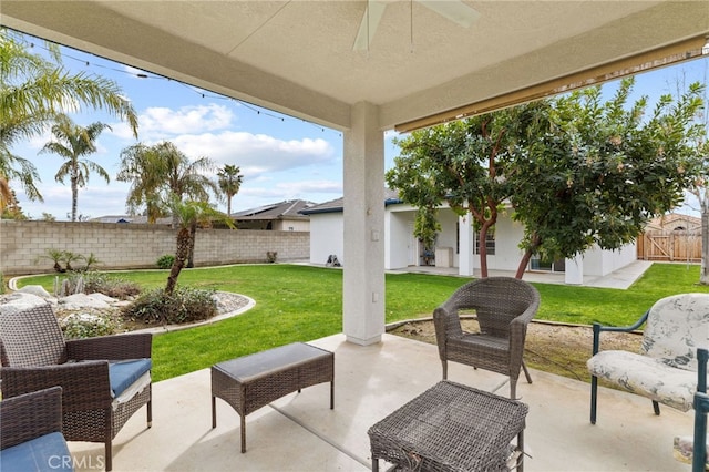 view of patio / terrace featuring a ceiling fan and fence