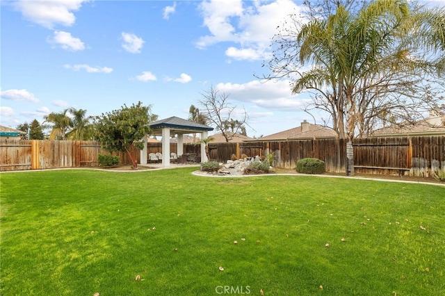 view of yard with a gazebo, a fenced backyard, and a patio