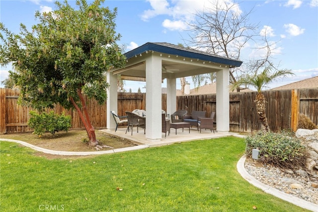 view of yard with a gazebo, a fenced backyard, and a patio area