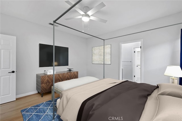 bedroom with visible vents, baseboards, ceiling fan, and wood finished floors