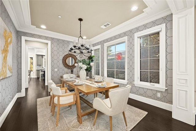 dining room with visible vents, baseboards, ornamental molding, and wallpapered walls