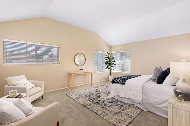 bedroom with lofted ceiling, baseboards, and carpet floors