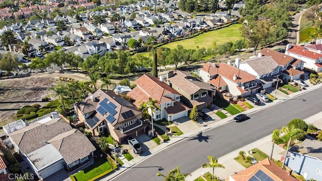 birds eye view of property with a residential view