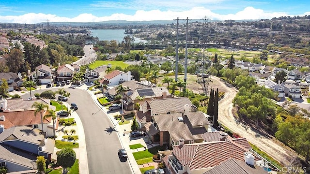 birds eye view of property featuring a residential view and a water view