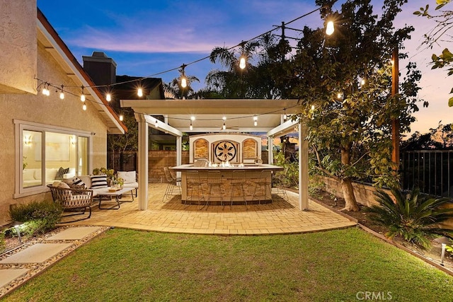 view of yard featuring a patio area, an outdoor living space, outdoor dry bar, and a fenced backyard