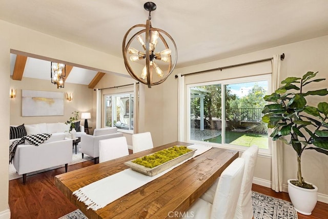 dining space with a notable chandelier, wood finished floors, and a healthy amount of sunlight