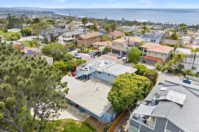 drone / aerial view featuring a water view and a residential view