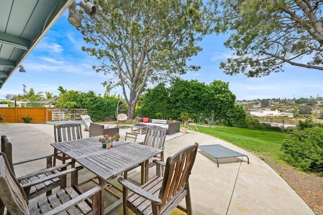 view of patio / terrace with outdoor dining space, an outdoor hangout area, and fence