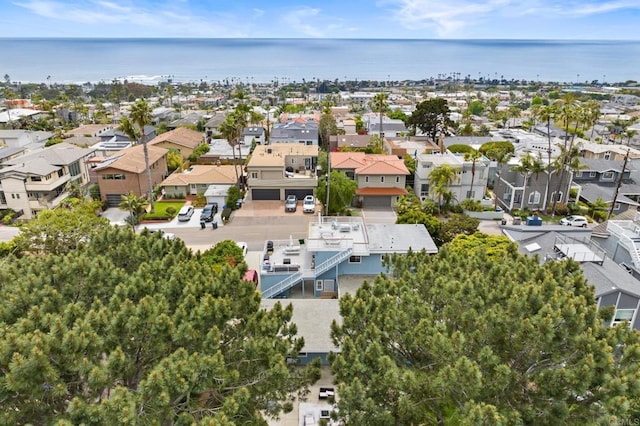 bird's eye view featuring a residential view and a water view