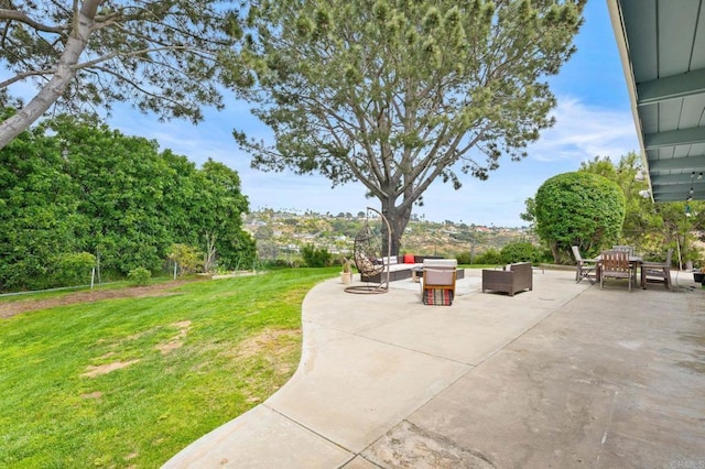 exterior space with outdoor dining space, an outdoor living space, a lawn, and a patio