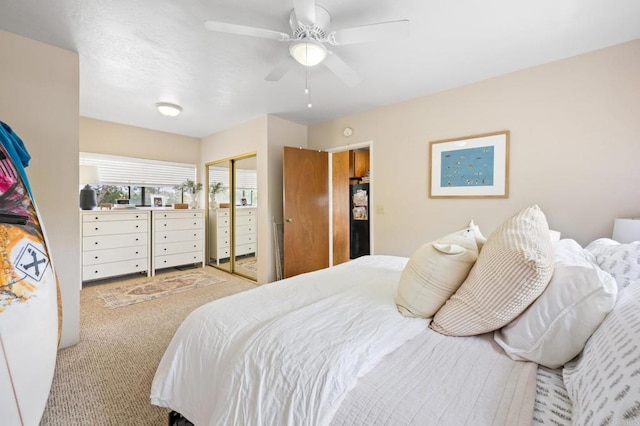 bedroom featuring a closet, a ceiling fan, and carpet floors