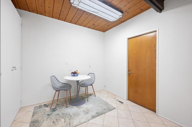 dining area with tile patterned floors, visible vents, wood ceiling, and lofted ceiling with beams