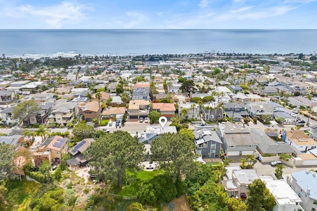 drone / aerial view featuring a residential view and a water view