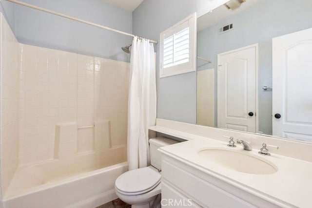 full bathroom featuring visible vents, vanity, toilet, and shower / bath combo with shower curtain