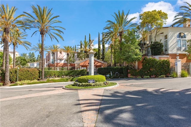 view of road featuring a residential view and curbs