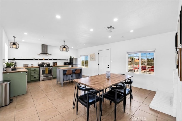 dining space with light tile patterned floors, recessed lighting, and visible vents