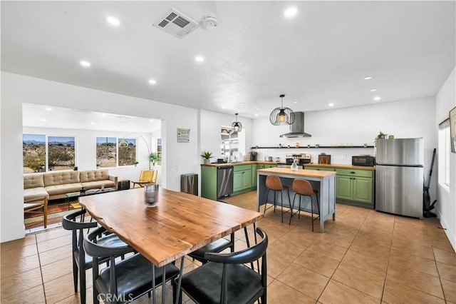 dining room featuring light tile patterned flooring, visible vents, and recessed lighting