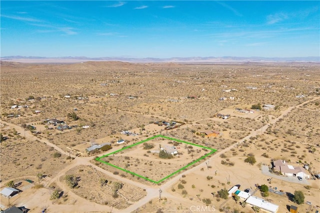 bird's eye view featuring a mountain view, a rural view, and a desert view