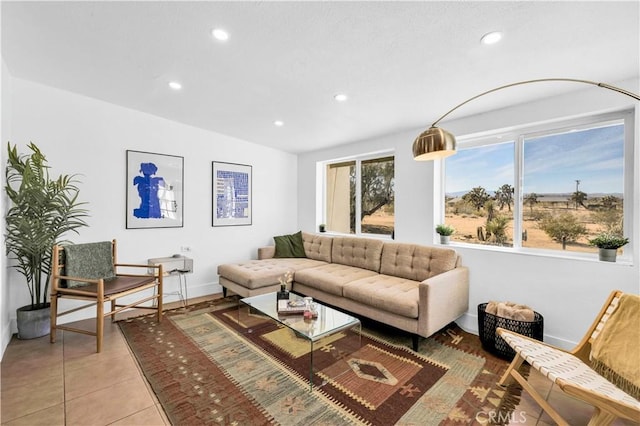 living room with recessed lighting, baseboards, and light tile patterned flooring