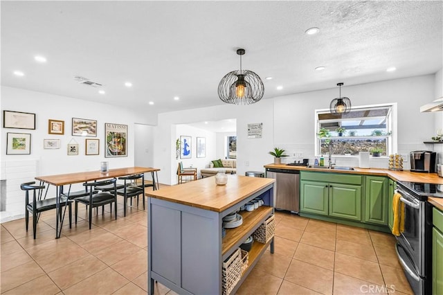 kitchen with visible vents, open shelves, a sink, stainless steel appliances, and butcher block countertops