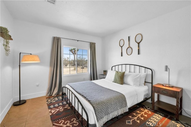 tiled bedroom featuring visible vents and baseboards