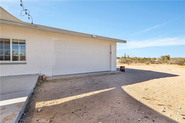 garage featuring driveway