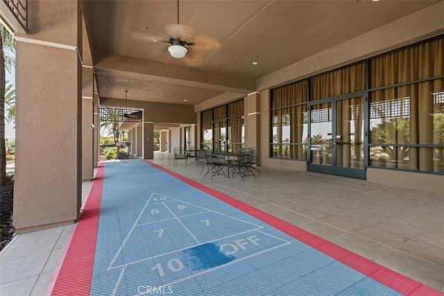 view of home's community featuring shuffleboard