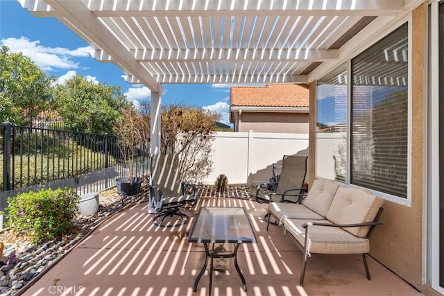 view of patio / terrace featuring a fenced backyard, a pergola, and an outdoor hangout area