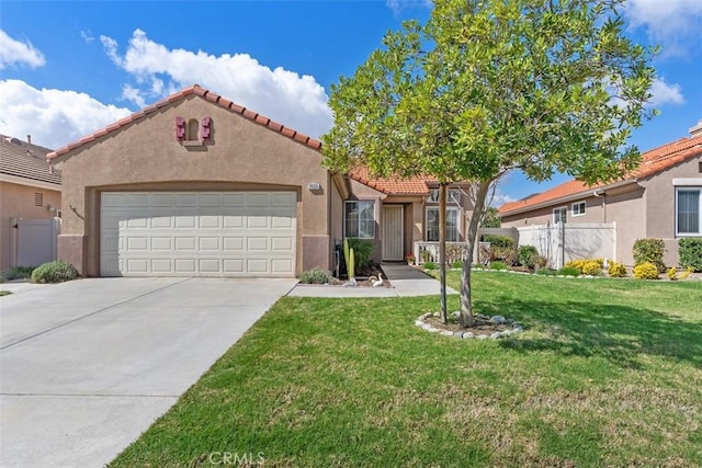 mediterranean / spanish-style house with stucco siding, driveway, an attached garage, and fence