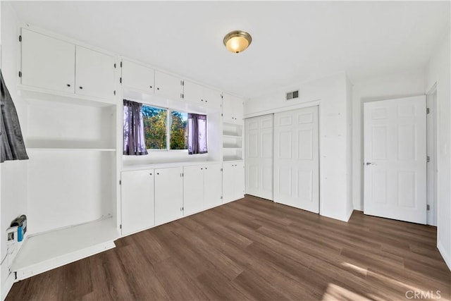 9970 Shadow Hills Dr, Sunland, CA 91040 - unfurnished bedroom featuring a closet, dark wood-type flooring, and visible vents