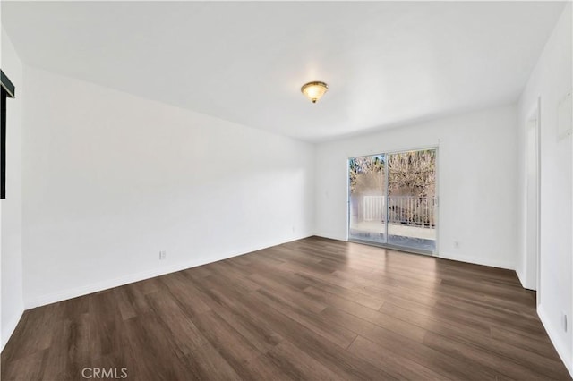 9970 Shadow Hills Dr, Sunland, CA 91040 - spare room with baseboards and dark wood-type flooring