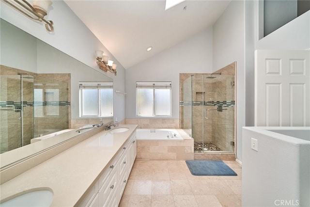 full bath featuring lofted ceiling, double vanity, a stall shower, a sink, and tiled bath