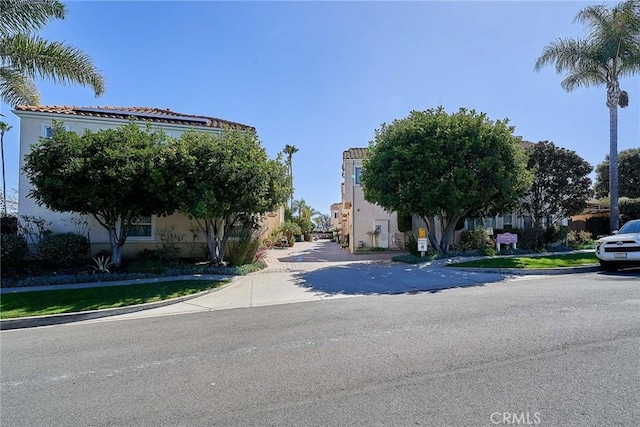 view of street with curbs