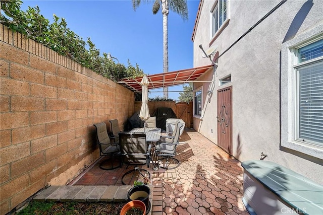 view of patio / terrace with outdoor dining area and a fenced backyard