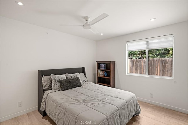 bedroom featuring recessed lighting, wood finished floors, and baseboards