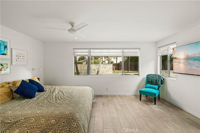 bedroom with recessed lighting, baseboards, wood finished floors, and a ceiling fan