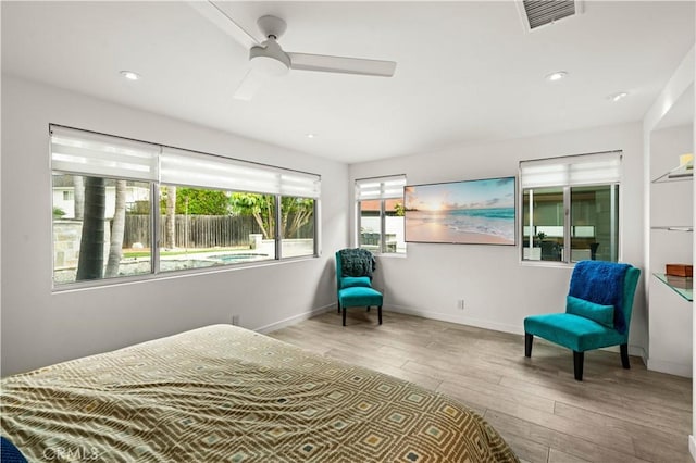 bedroom featuring visible vents, recessed lighting, baseboards, and wood finished floors