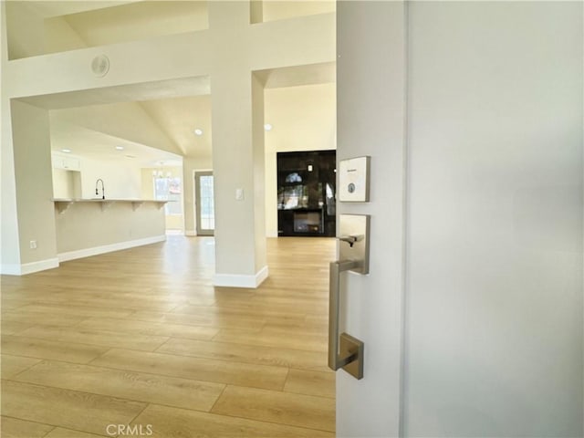 interior space with baseboards and light wood-style floors