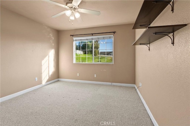 unfurnished room featuring ceiling fan, baseboards, and carpet floors