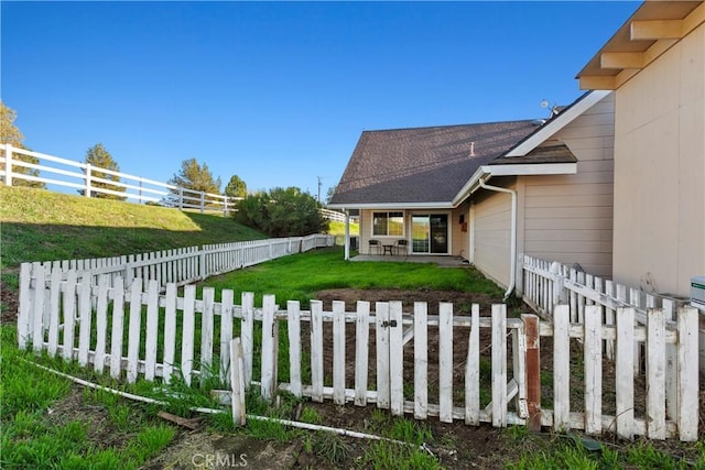 view of yard featuring a patio area and a fenced backyard